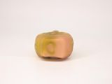 yellow and pink glass bead on white surface with white background