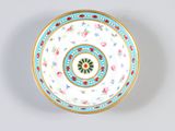 a white plate with a floral design on it
