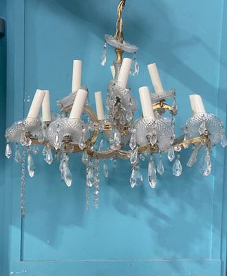 a chandelier hanging from the ceiling in a room