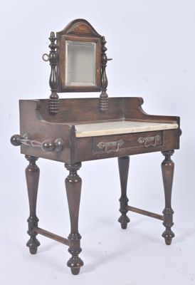 a small desk with a mirror on top of it