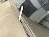 a sticker on the side of a car that is parked in a parking lot