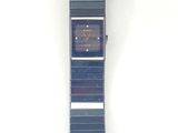 an image of a watch on a white surface with a white background
