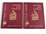 two red books with gold lettering on them sitting next to each other