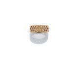 a close up of a gold ring on a white surface