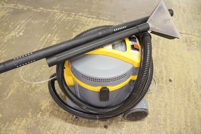 a yellow and black vacuum cleaner on the floor
