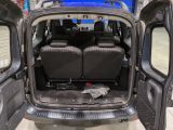two seats in the back of a van with the doors open
