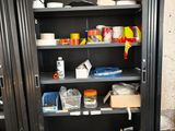 a metal cabinet with a bunch of items on it