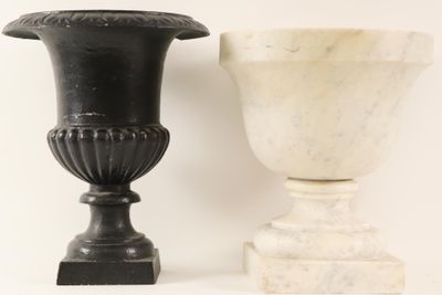 two vases sitting next to each other on a table