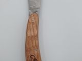 a knife with a wooden handle on a white surface