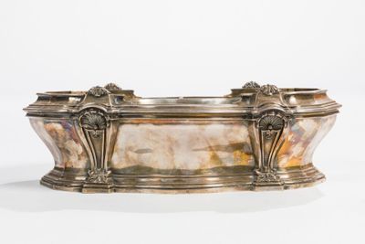 silver plated bathtub with two lions on the sides of the tub