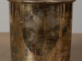 a silver cup that is sitting on a table