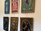 four framed pictures hanging on the wall of a room