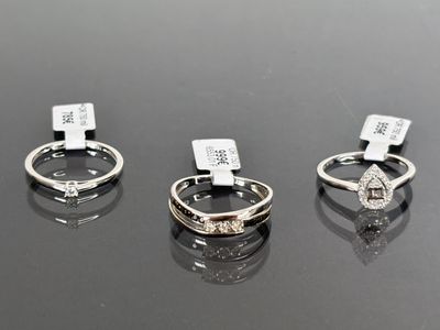 three different types of rings are shown on a black surface