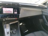 the interior of a car with a steering control and a dash board