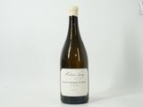 a bottle of wine that is sitting on a table