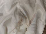 a white bed spread with a white comforter on it