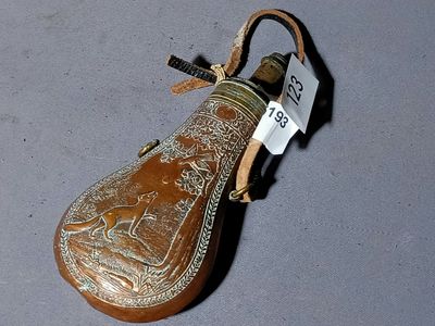 a small bottle that has a tag on it