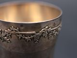 a silver cup that is sitting on a table