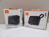 two boxes of the new jbl go portable waterproof speaker