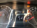 a close up of a car dashboard with a speedometer and gauges