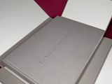 three books are stacked on top of each other on a table