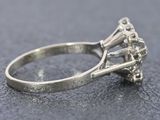 a close up view of a diamond ring on a table