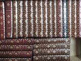 a lot of books that are stacked on a shelf