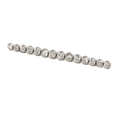 a close up of a diamond bracelet on a white background