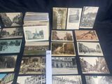 several old postcards of old buildings and buildings on a table