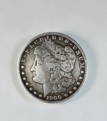 a close up of a coin with a woman ' s face on it