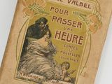 an old book with a picture of a woman and a child on it