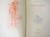 an open book with a drawing of a nude on it
