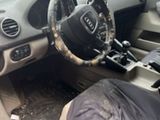 dashboard of a car with a dirty seat and steering wheel
