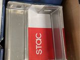 a box with a pair of scissors inside of it