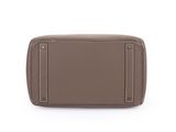 a brown leather purse on a white background