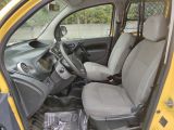 a small yellow car with two seats and a steering wheel