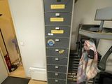 a room with a desk and a filing cabinet