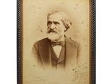an old photo of a man with a beard and a bow tie