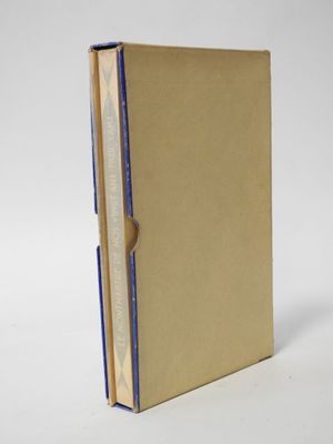 a brown book with a blue strip on the front of it