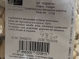 a bag of peanuts sitting on a table with a price tag