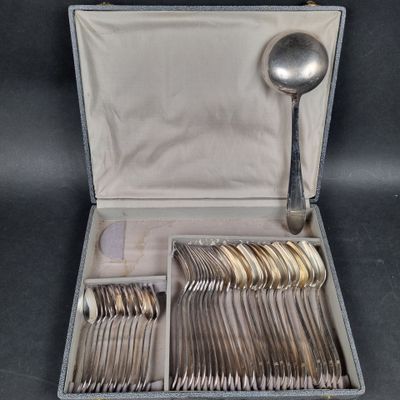 a case with silverware in it on a black surface
