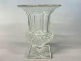 a glass vase that is sitting on a table