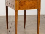 an image of a small table with drawers on it