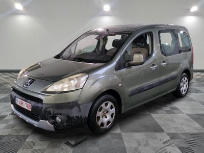 a picture of a small grey van parked in a garage