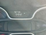 a digital clock on the dashboard of a car