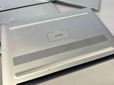 two laptops sitting side by side on a table