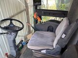 une image représentant un camion avec un volant et un siège