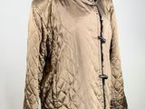 an image of a jacket on a mannequin stand on a white background