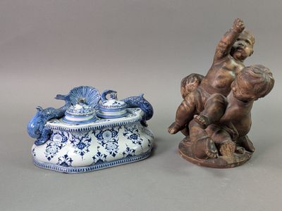 two figurines sitting next to each other on a table