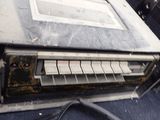 an old radio sitting on top of a table